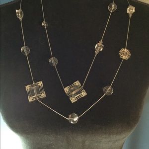 Long necklace with pretty beads and medallions.